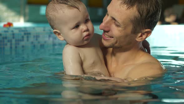 Father with Son in the Pool