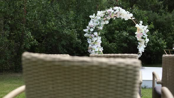 round wedding arch of flowers for the ceremony in the park