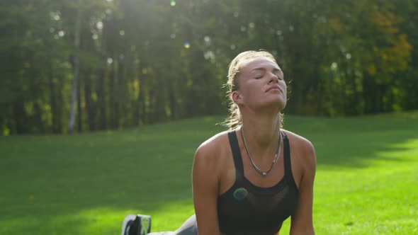 Handicapped Woman Practicing Yoga at Park. Girl Stretching Body at Morning