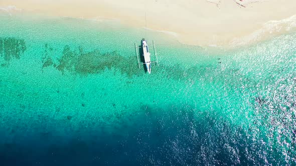 Daytime birds eye abstract shot of a white paradise beach and blue ocean background in high resoluti