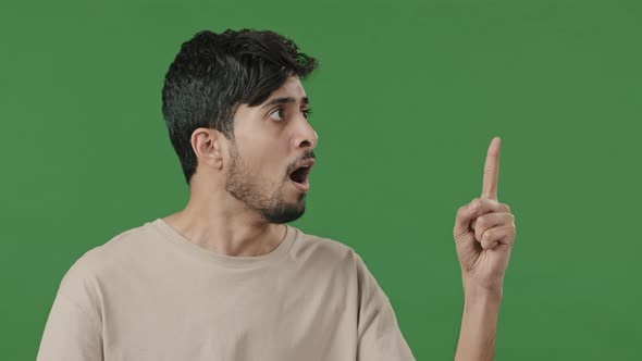 Studio Male Portrait on Green Background Young Thoughtful Arabic Guy Creator Thinking Pondering Plan