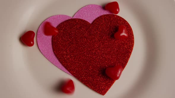 Rotating stock footage shot of Valentines decorations and candies - VALENTINES 0117