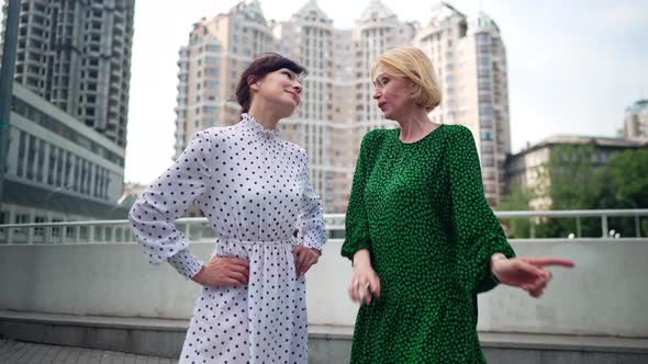 Portrait of Happy Joyful Elegant Women Dancing in Slow Motion Singing on Weekend Outdoors