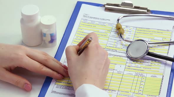 Therapist Completing Health Insurance Claim Form, Payment for Medical Benefits