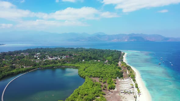 Tropical fly over clean view of a white sandy paradise beach and blue sea background