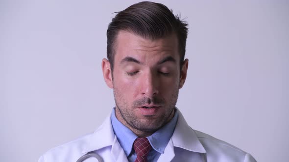 Young Stressed Hispanic Man Doctor Looking Frustrated