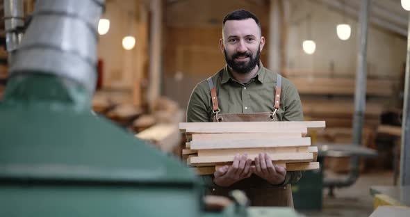 Man Working with Wood at the Joinery