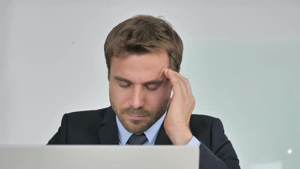 Headache Close Up of Businessman with Problems