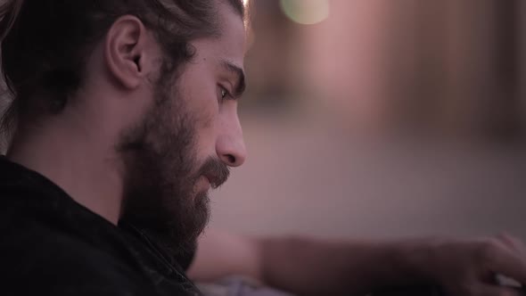 Attractive Male Gets His Face Lighted By His Phone Screen Light