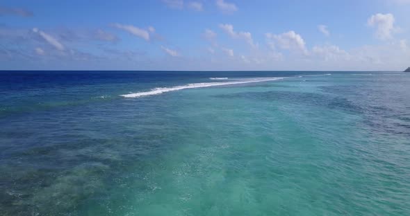 Tropical flying abstract view of a summer white paradise sand beach and turquoise sea background 