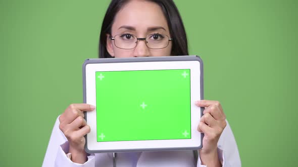Young Beautiful Asian Woman Doctor Showing Digital Tablet