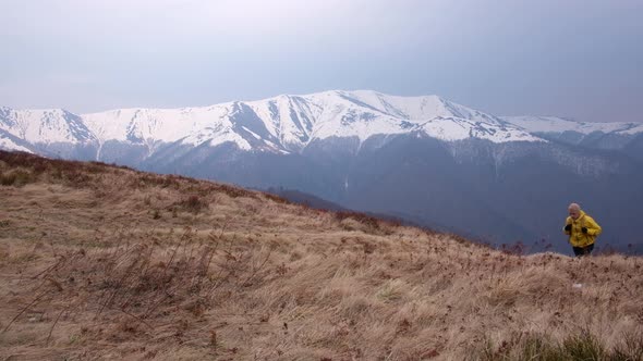 Man with Backpack in Spring Mountains