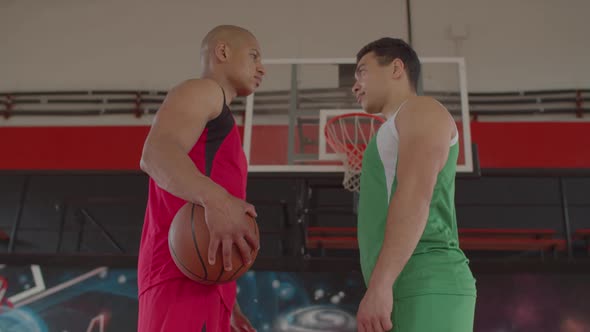 Two Basketball Players Standing Face To Face