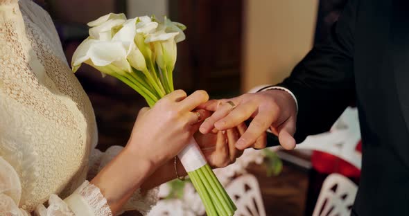 Wedding. The Bride Puts The Wedding Ring On The Groom