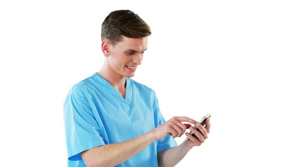 Smiling surgeon using mobile phone