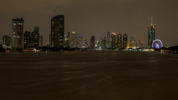 Heavy Rain and Lightening during Monsoon at the Chao Phraya River with Bangkok City Skyline