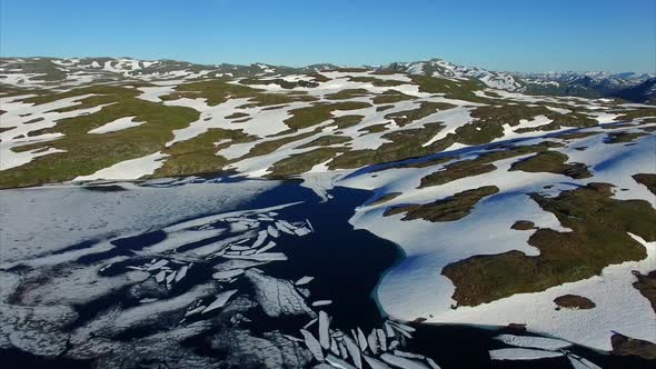 Descent above frozen lake in Norway