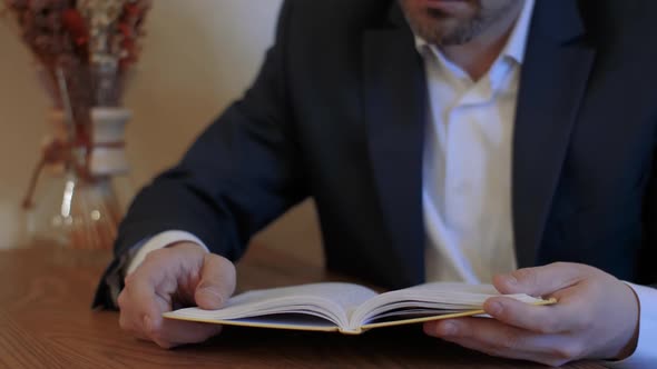 Man Reads Book