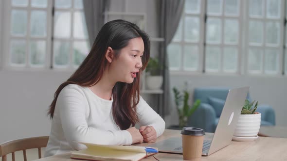 Pretty Girl Having Video Call On Laptop Computer At Home