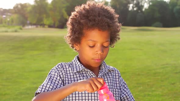 Fun Boy Is Making Bubbles.