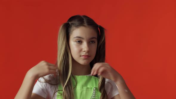 Portrait of a Smiling 11Yearold Girl in the Studio