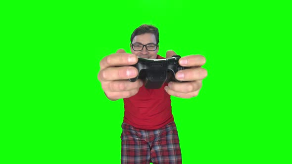 Gamer Man Makes Faces Playing on Game Console. Green Screen