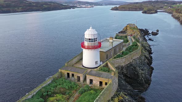 Aerial of the Rotten Island Lighthouse with Killybegs in Background - County Donegal - Ireland