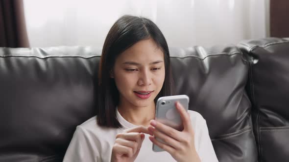 woman using smartphone, During leisure time.