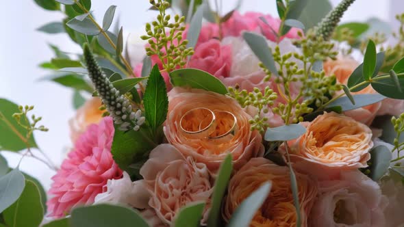 Rings Lying on a Wedding Bouquet.