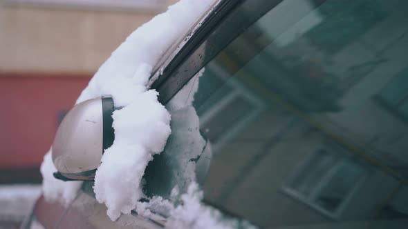 Parked Car with Thick White Snow Layer After Heavy Snowfall