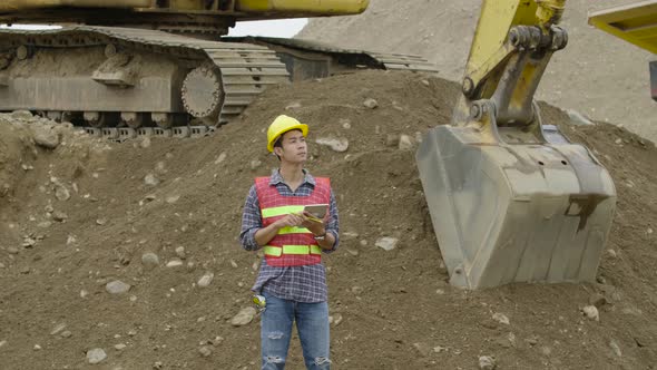 Construction Using A Tablet Computer At A Construction Site alt