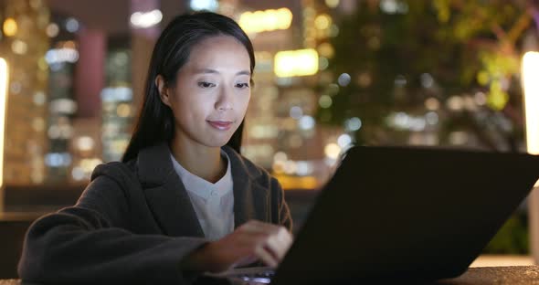 Woman Work on Laptop Computer at Night