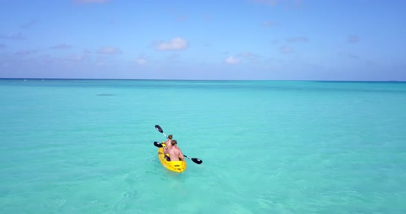 Young couple on romantic honeymoon enjoy life on beach on paradise white sand 4K background