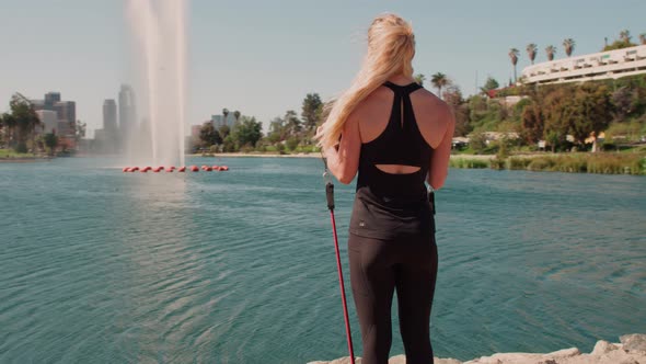 Very Athlete Woman Works Out In The Park