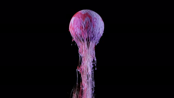 Multicolored Ink Paint Slowly Flows From the Ball