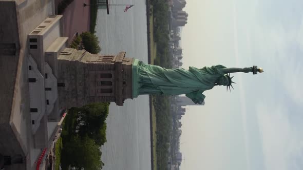 Aerial view around the Statue of Liberty, in NYC, USA - Vertical, orbit, drone shot