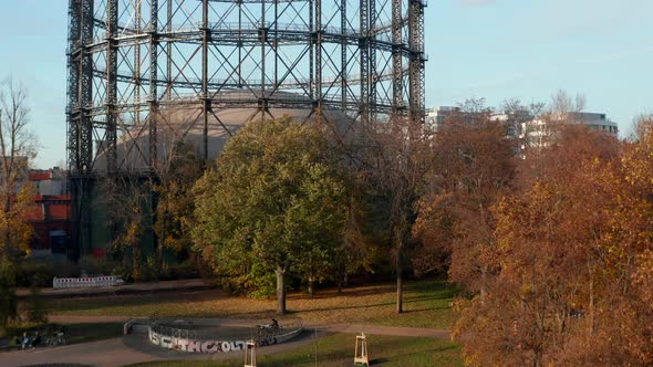 Famous Gasometer in Berlin, Germany Surrounded By Autumn Colored Trees and Nature in Big City