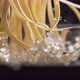 Throwing linguine noodle in water. Slow Motion. - VideoHive Item for Sale