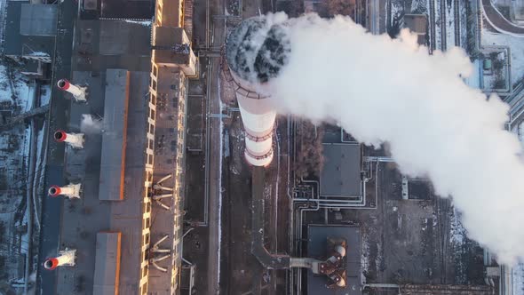 Industrial Emission carbon gases from factory pipes with smoke in atmosphere