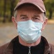 Close Up Portrait of Senior Man Wearing Protective Medical Face Mask - VideoHive Item for Sale