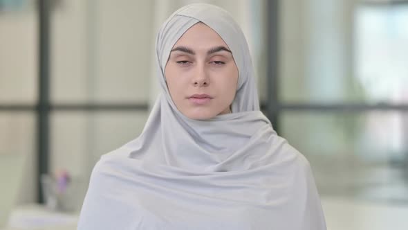 Young Arab Woman Looking at Camera