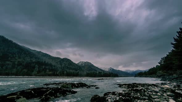 Time Lapse Shot of a River Near Mountain Forest, Huge Rocks and Fast Clouds Movenings