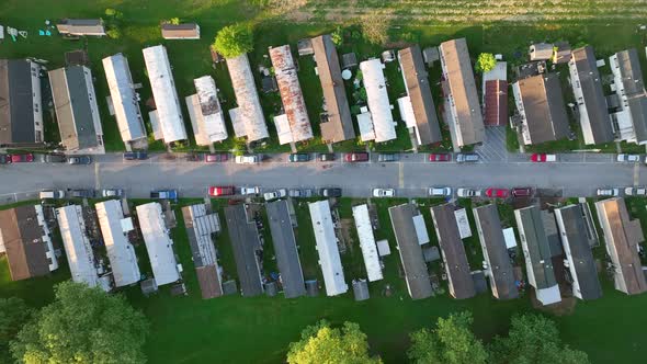 Top down aerial view of mobile home park in America. Run down, cheap housing crammed into small spac