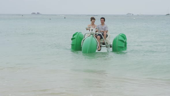 Couple on water tricycle in Hawaii