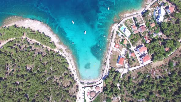 Aerial view of people swimming in turquoise water of the island of Brac, Croatia