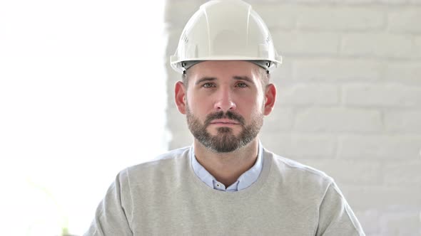 Portrait of Serious Young Engineer Looking at the Camera