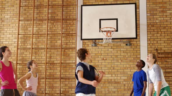 Group of high school kids playing basketball