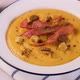 Pumpkin Cream Soup is Poured in a Plate Closeup - VideoHive Item for Sale