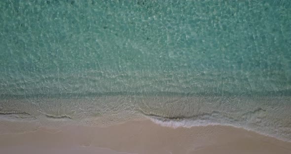 Luxury birds eye clean view of a white sand paradise beach and aqua turquoise water background 