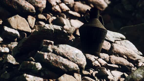 Old Metal Jug at Rocks alt